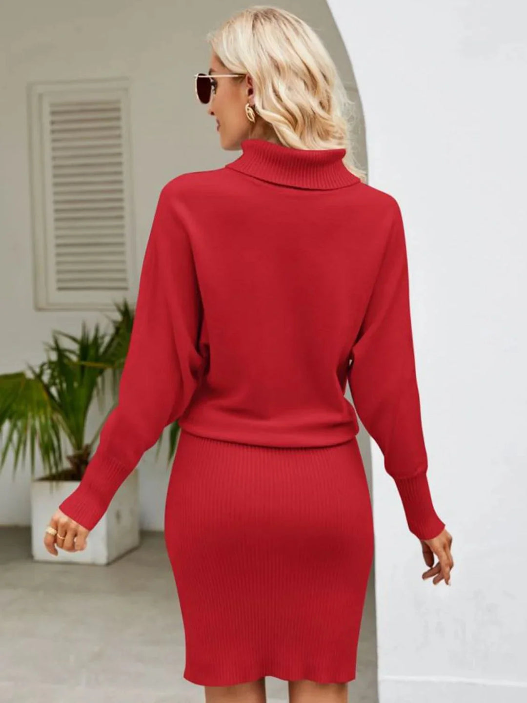 Ribbed knit turtleneck midi dress in Adalina with a sleek and stylish design, perfect for cooler weather occasions.