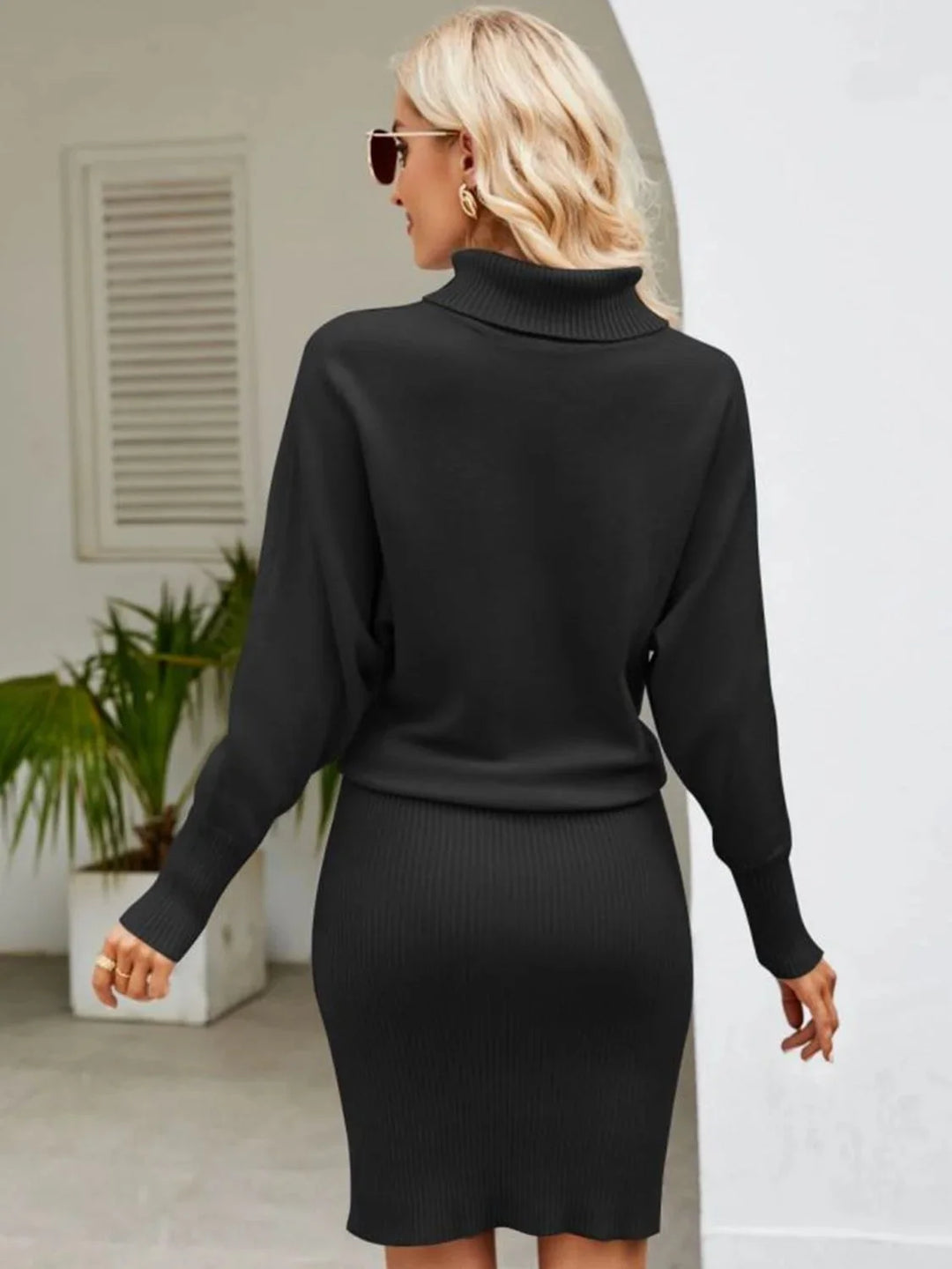 Navy ribbed knit turtleneck midi dress in a sleek design with long sleeves and a flattering silhouette.