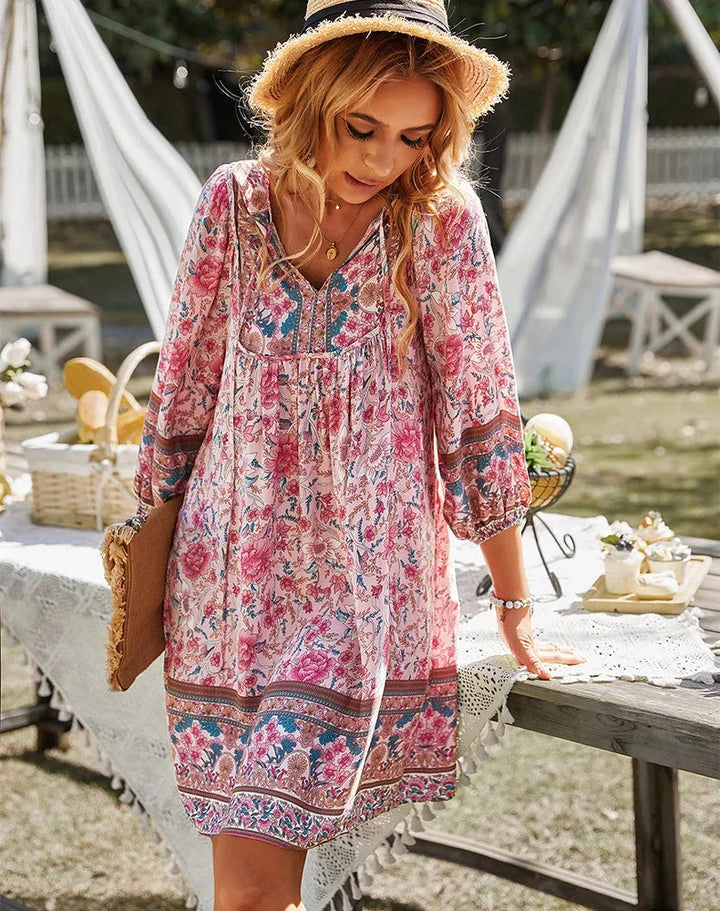 "Flowy bohemian mini dress in Pink with sleeves, perfect for a carefree summer look. Soft and lightweight material for…