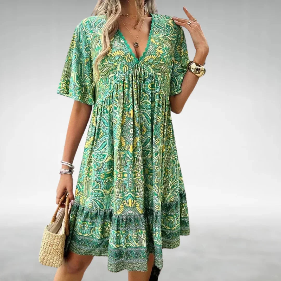 Bohemian mini dress with drawstring neckline in a relaxed fit and flowing silhouette - perfect for a casual yet chic look.