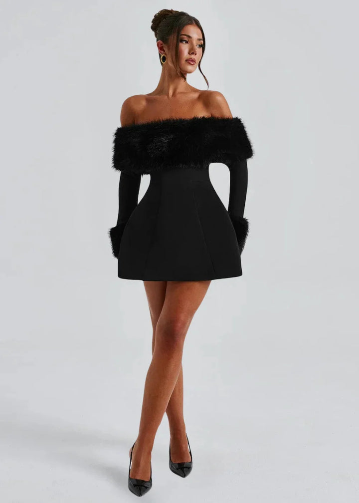 Black off-shoulder mini dress with fur accents, showcasing a stylish and elegant design perfect for a special occasion.