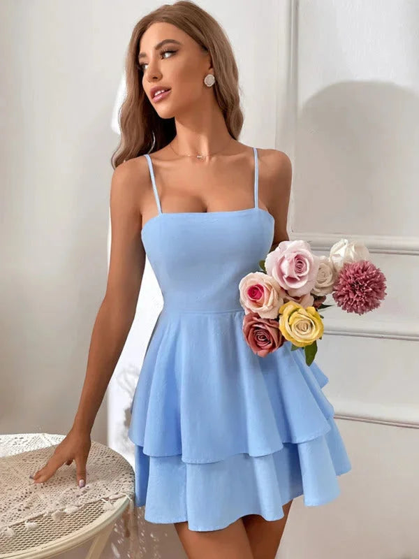 Blue tiered mini dress with adjustable straps, made of soft cotton blend. Perfect for casual outings or summer events.