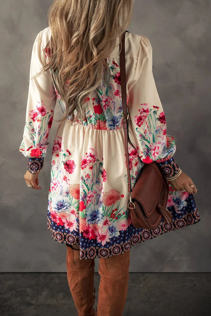 Flowy mini dress with colorful floral print, perfect for spring. Soft and breathable fabric, off-shoulder design with…