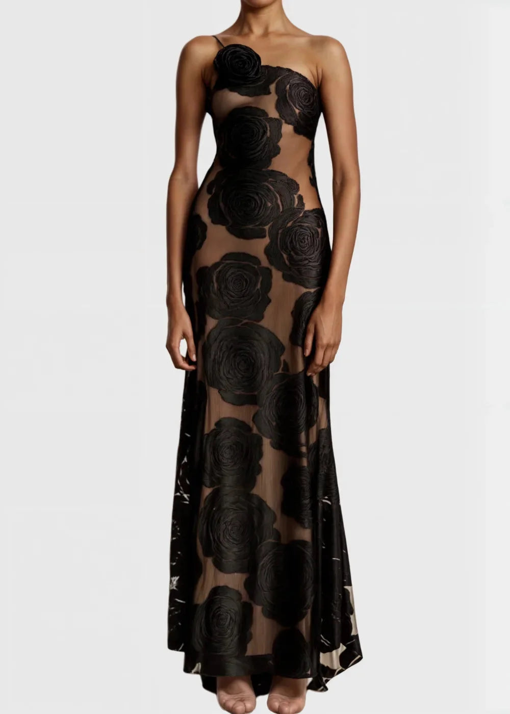 One-shoulder maxi dress with black roses pattern on sheer fabric, ariella design, stunning evening wear.