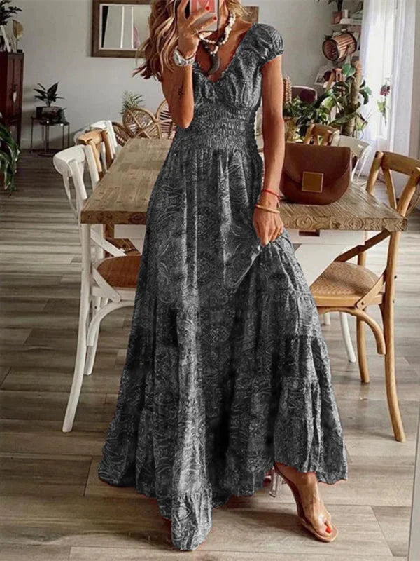 "Arleth V-neck maxi dress in bohemian style with tiered design, ideal for a casual-chic look with comfortable fabric."