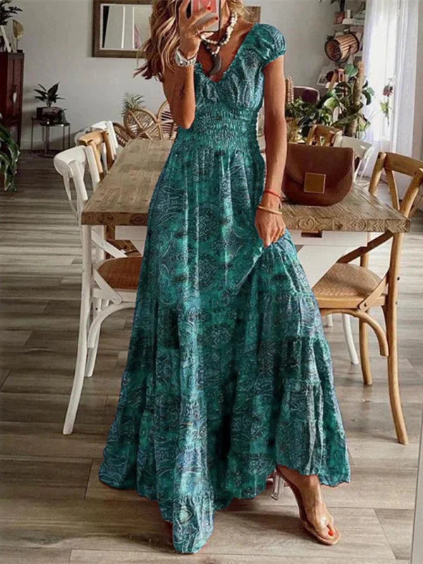 Light green V-neck maxi dress, featuring bohemian style with tiers. Made of soft, flowing fabric ideal for a relaxed yet…