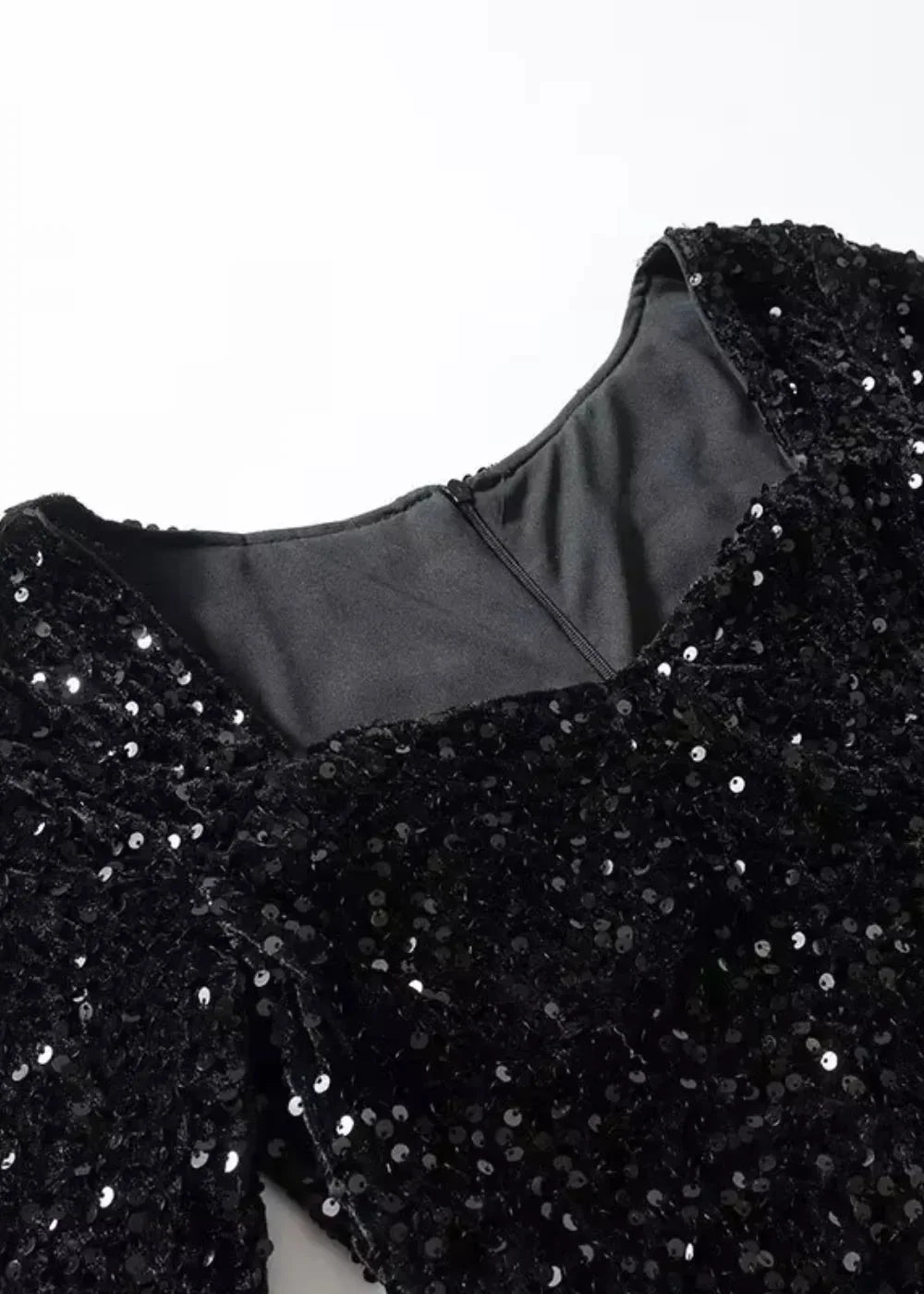 "Black sequined dress with a sweetheart neckline, perfect for glamorous evenings, elegant and eye-catching design, ideal for…