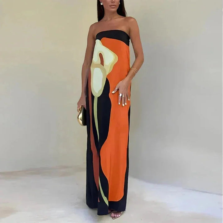 Orange strapless maxi dress featuring a free-flowing design. Made from lightweight and breathable fabric for a comfortable…