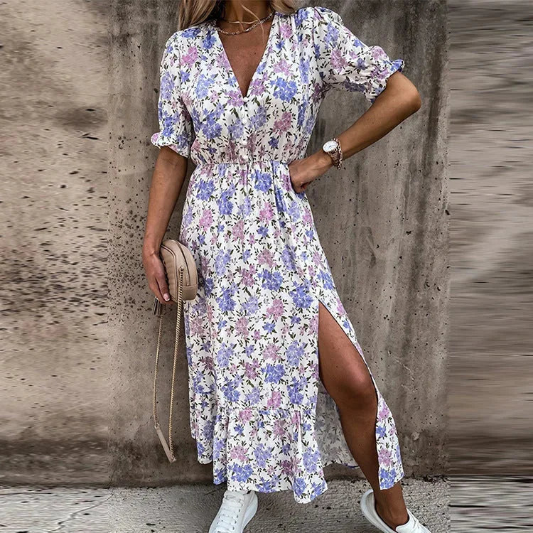 Purple floral midi dress with wrap front; featuring vibrant floral print and a flattering silhouette.