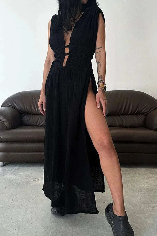 Black halter maxi dress with alluring cutouts, perfect for a night out. Made from breathable fabric for comfort in warm…