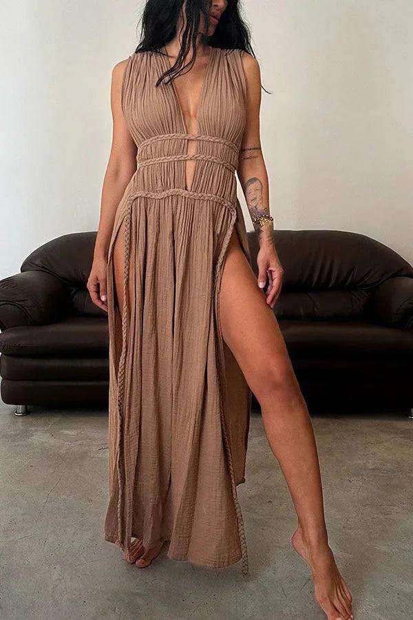 Brown halter maxi dress with cutouts, perfect for the summer. Made with lightweight fabric for a breezy and stylish look.