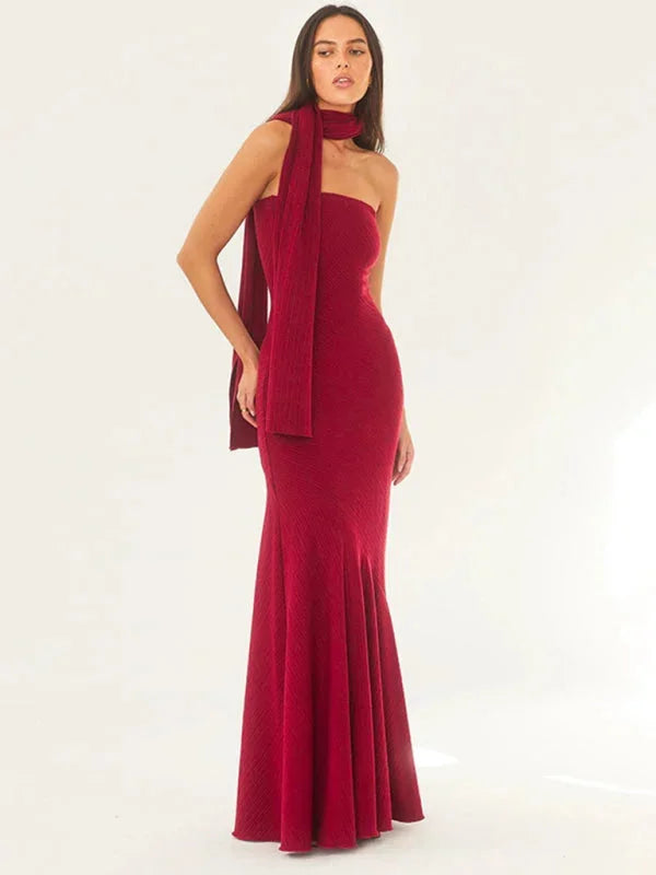 Red strapless dress with scarf, mermaid silhouette. Features a sleek, body-hugging design and crafted in breathable fabric.