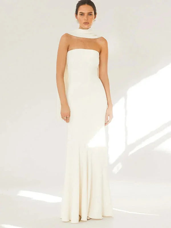 White strapless dress with scarf, mermaid silhouette. Crafted from soft fabric with elegant draping for a sophisticated look.