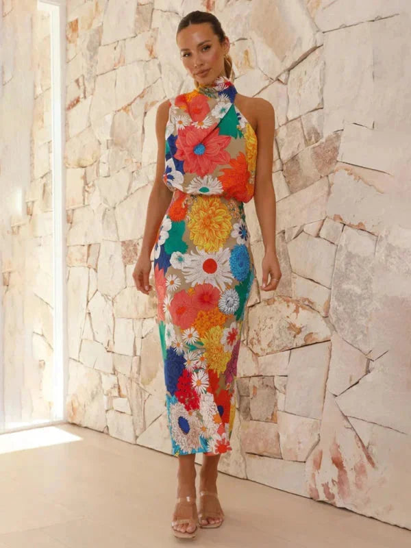 "Women's halter midi dress featuring colorful floral pattern, perfect for summer outings and events."