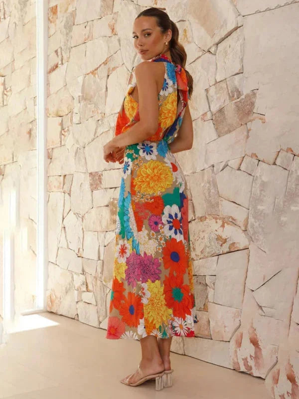 "Floral halter midi dress with vibrant colors and intricate patterns, perfect for summer outings."