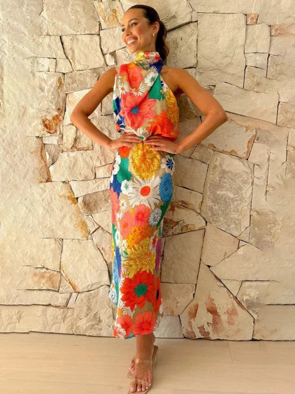 "Floral halter midi dress in vibrant colors with a whimsical design, perfect for summer days out or casual gatherings."