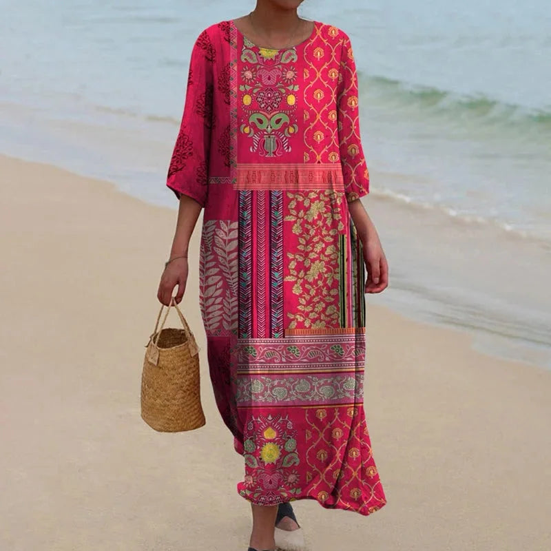 Pink bohemian maxi dress featuring ethnic prints, perfect for a free-spirited look.