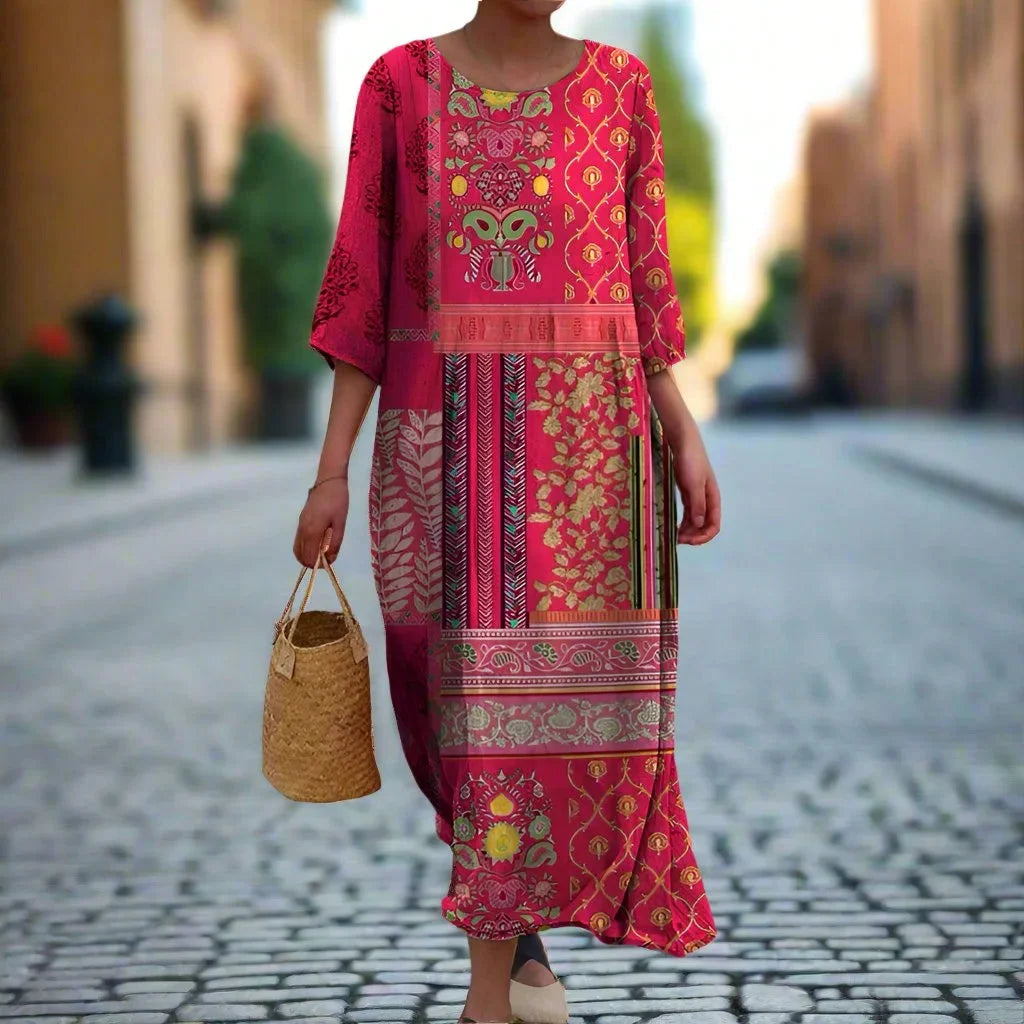 Pink bohemian maxi dress with ethnic prints, perfect for a relaxed and stylish look. Made with lightweight and flowy fabric.