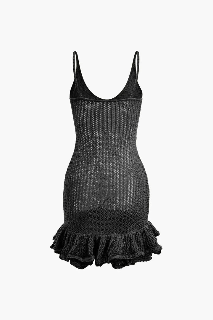 "Black textured mini dress with ruffles, perfect for a playful and chic look."