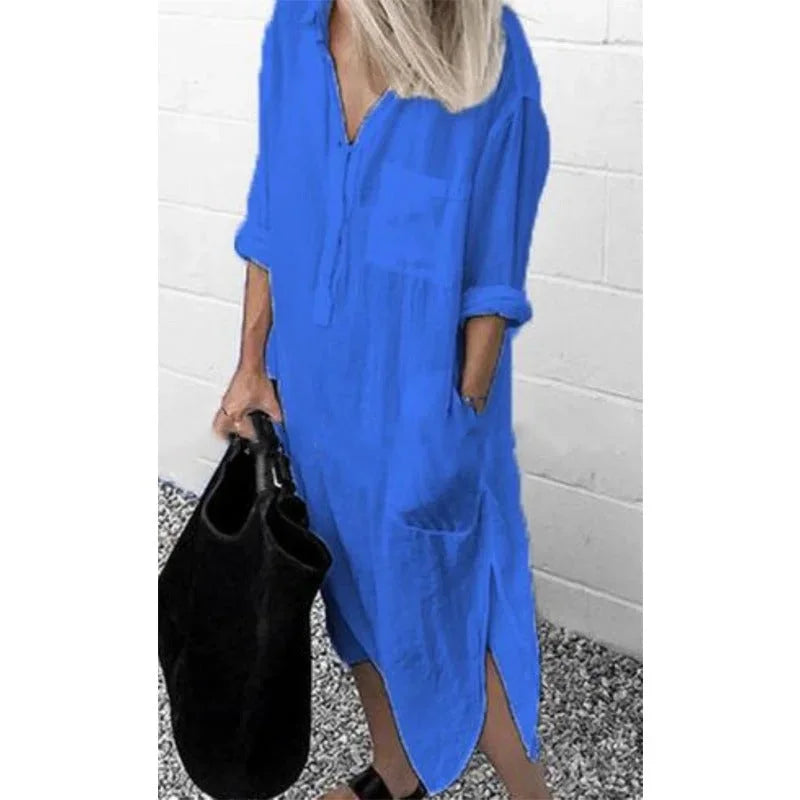 Blue linen button-up dress in relaxed fit with collar and rolled-up sleeves, perfect for casual chic summer style.