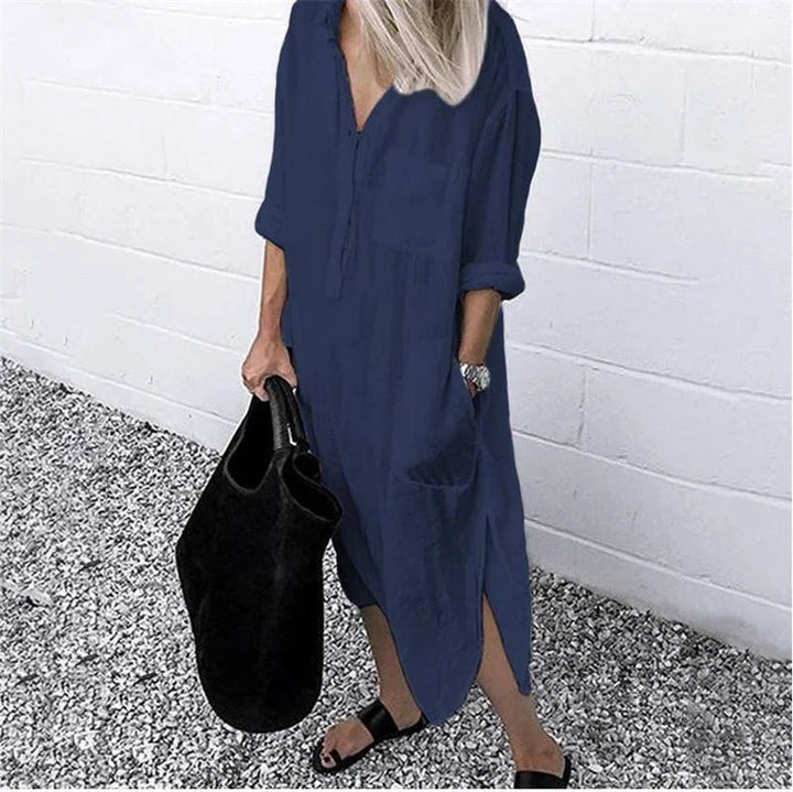 Dark blue linen button-up dress with a relaxed fit and casual look perfect for any occasion.