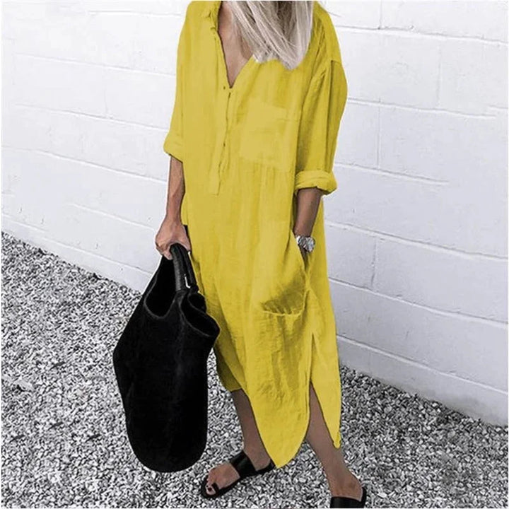 Yellow linen button-up dress with a relaxed fit design. Perfect for a casual and chic summer look.