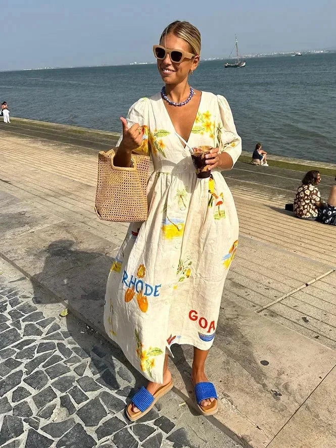 Beige V-neck maxi dress with floral design, made in breezy style.