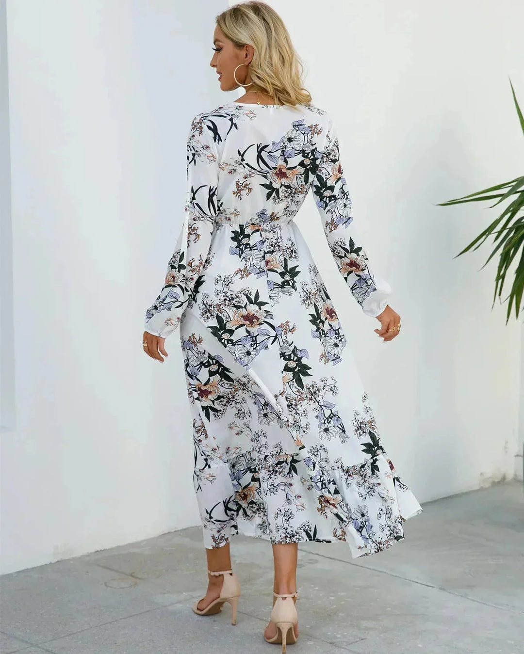 White floral midi dress with belt featuring a delicate blossom pattern in a soft and flowy fabric perfect for a stylish yet…