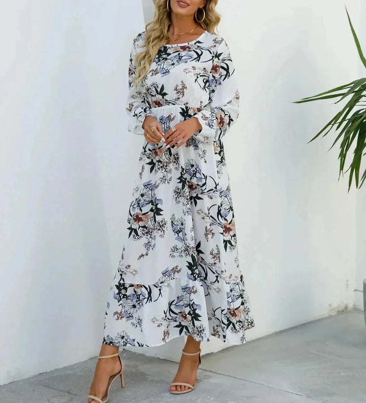 White floral midi dress with belt in a charming floral print. Features a flattering fit and flare silhouette in a soft,…