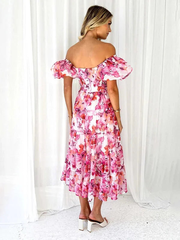 "Flowing tiered summer dress with floral print in lightweight fabric, perfect for sunny days"