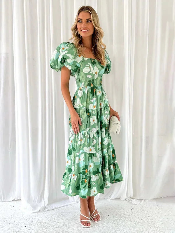 "Flowing floral tiered summer dress with a light and airy fabric perfect for warm days."