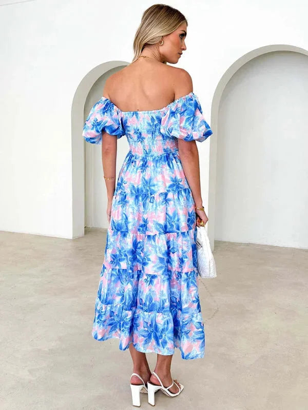 Flowing floral tiered summer dress with a lightweight design perfect for warm weather outings.