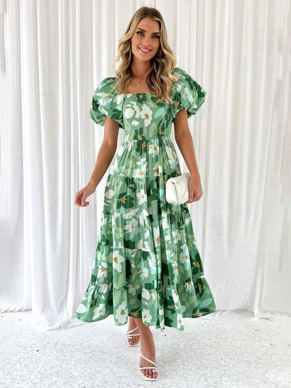 "Pale green floral tiered summer dress with flowing silhouette, perfect for warm days. Made from lightweight and breathable…