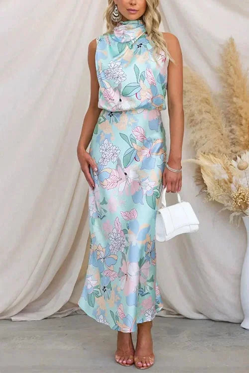 "Pastel floral maxi dress with high neck, perfect for spring. Soft and flowy material with elegant design."