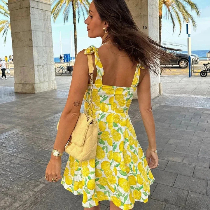 Yellow sleeveless mini dress with lemon print, perfect for summer. Made of lightweight cotton with a flattering A-line…