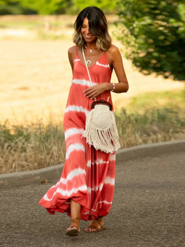 "Sleeveless V-neck tie-dye dress in soft fabric with a flowing silhouette, perfect for casual summer days."