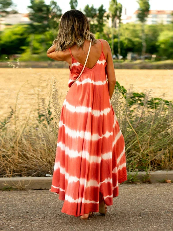 "Sleeveless tie-dye dress with V-neck in soft organic cotton, perfect for casual days out or beach walks."