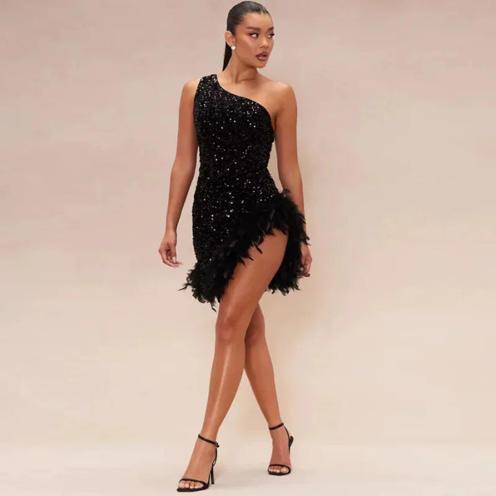 Black sequin dress with asymmetrical feather trim, perfect for a high-fashion event or glamorous occasion.