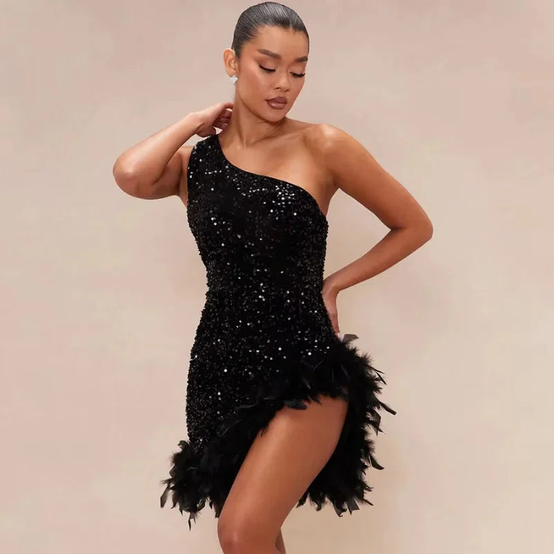 Asymmetrical black dress with feather trim and sequin detailing by Dakotah.