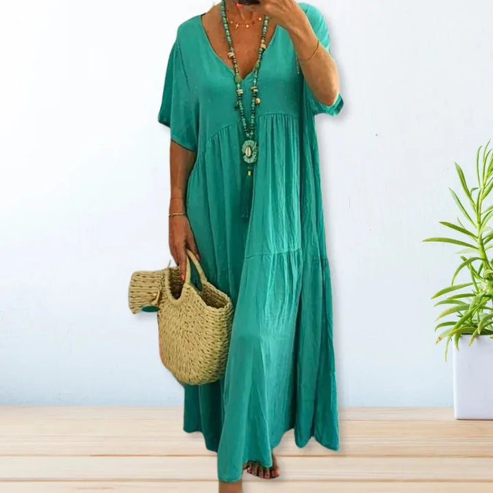 Turquoise V-neck maxi dress made of lightweight fabric, perfect for summer. Flows beautifully with a relaxed silhouette.