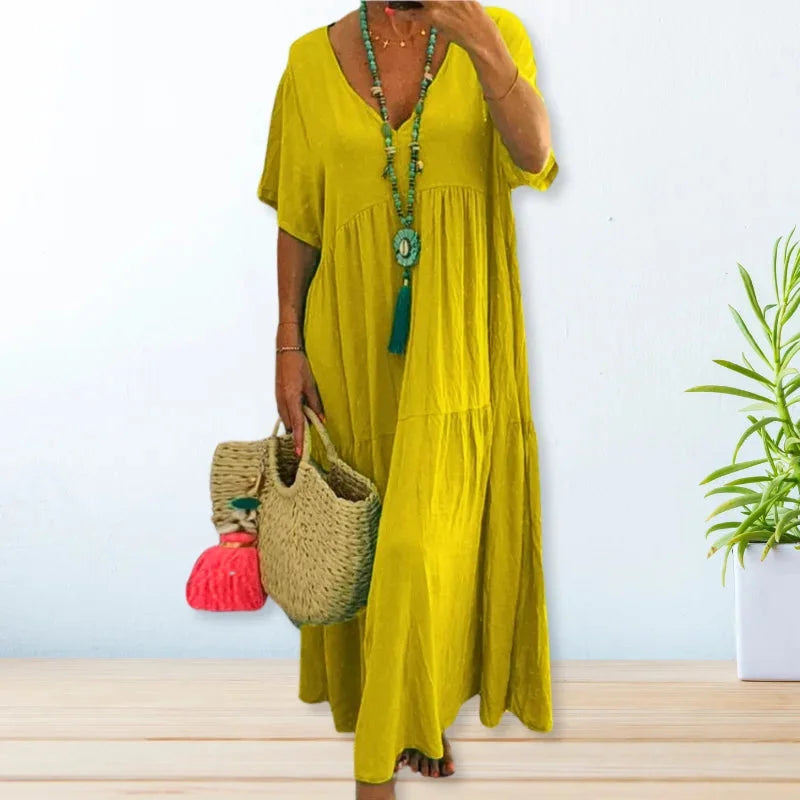 Yellow V-neck maxi dress by Dana, perfect for summer. Lightweight fabric with a flowy silhouette, ideal for warm weather…