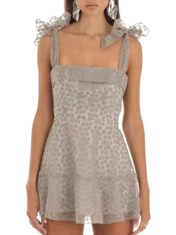 Grey A-line mini dress with lace detailing, perfect for a casual yet chic look. Made of cozy fabric for all-day comfort.