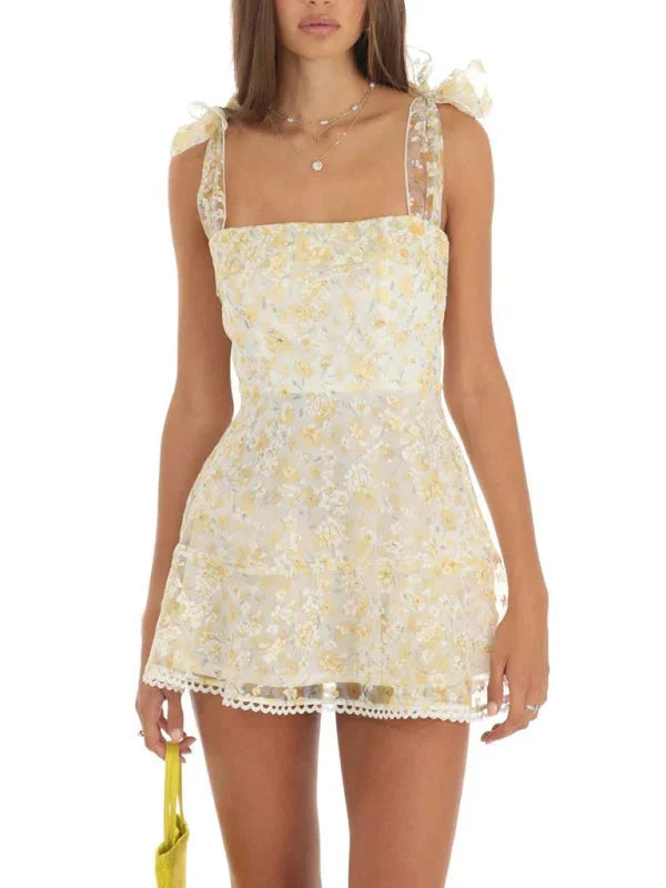 Light yellow A-line mini dress with elegant lace detailing. Softly woven fabric for effortless style.