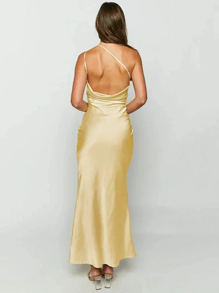 One-shoulder satin maxi dress with flowing design, perfect for elegant events.