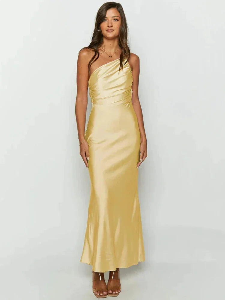 One-shoulder satin maxi dress in a flowing design with an elegant touch, perfect for special occasions.