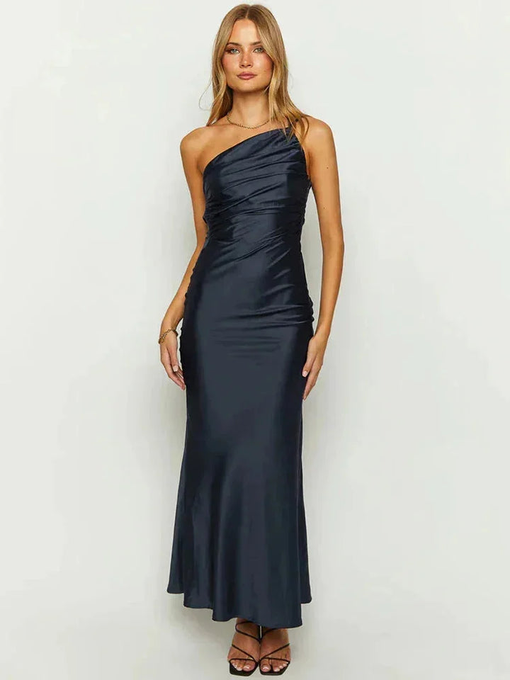 One-shoulder satin maxi dress in Black with a flowing design, perfect for a chic and elegant look.