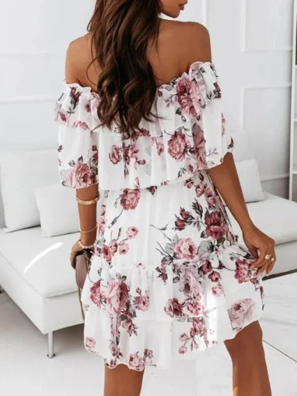 "Elia tiered floral mini dress with off-shoulder design made of lightweight fabric perfect for summer days."