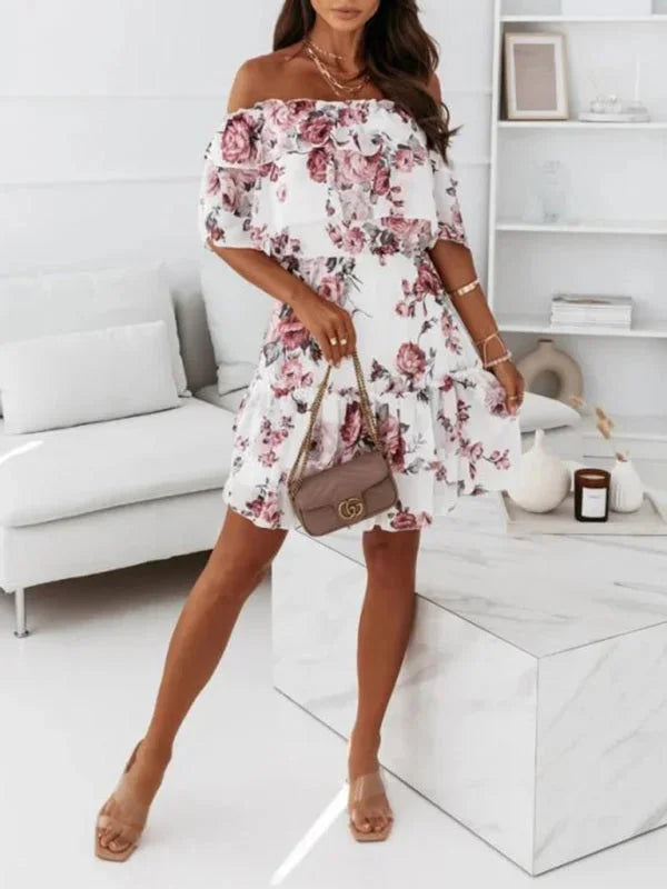 "Elia pink mini dress with tiered floral design and off-shoulder style, perfect for a summer day out"