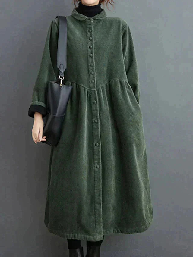 Green structured warm dress with button-front design, made of soft and durable fabric. Perfect for staying stylish and cozy…