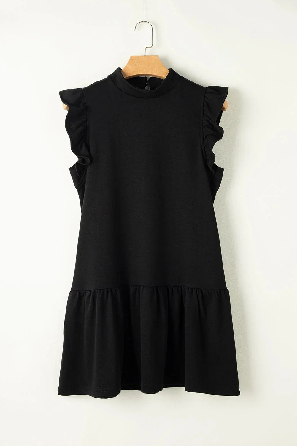 Black mini dress with ruffle detail sleeves, made of high-quality cotton blend fabric. Perfect for a stylish and chic look.